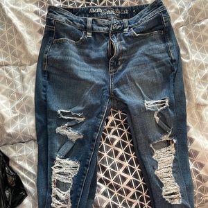 american eagle ripped jeans. darker blue